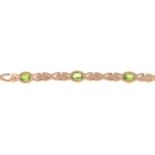 A 9ct gold peridot bracelet.Hallmarks for Sheffield, 1997.Length 20.5cms.