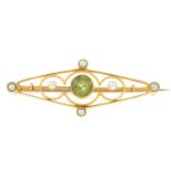 An early 20th century 15ct gold peridot and seed pearl brooch.Stamped 15ct.Length 4cms.