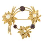 A 9ct gold garnet and cultured pearl floral brooch.Hallmarks for Birmingham, maker's mark D&F.