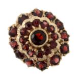A 9ct gold garnet cluster ring.Hallmarks for 9ct gold.