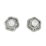 A pair of diamond floral stud earrings.Estimated total diamond weight 0.85ct,