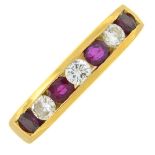 An 18ct gold ruby and diamond half eternity ring.Total diamond weight 0.50ct,