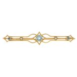 An early 20th century 15ct gold aquamarine and split pearl bar brooch.Stamped 15.Length 6.2cms.