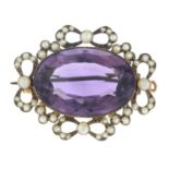 An amethyst and split pearl brooch.Stamped 9ct.Length 3.4cms.