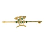 An 18ct gold bar brooch featuring an enamel shamrock and clover flower motif.Hallmarks for