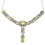 An early 20th century yellow and colourless paste necklace with a suspended drop.Length 36cms.