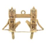 A 9ct gold articulated Tower Bridge charm.Hallmarks for London.Length 3.4cms.