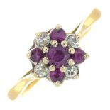 An 18ct gold ruby and diamond cluster ring.Hallmarks for London.Ring size G.