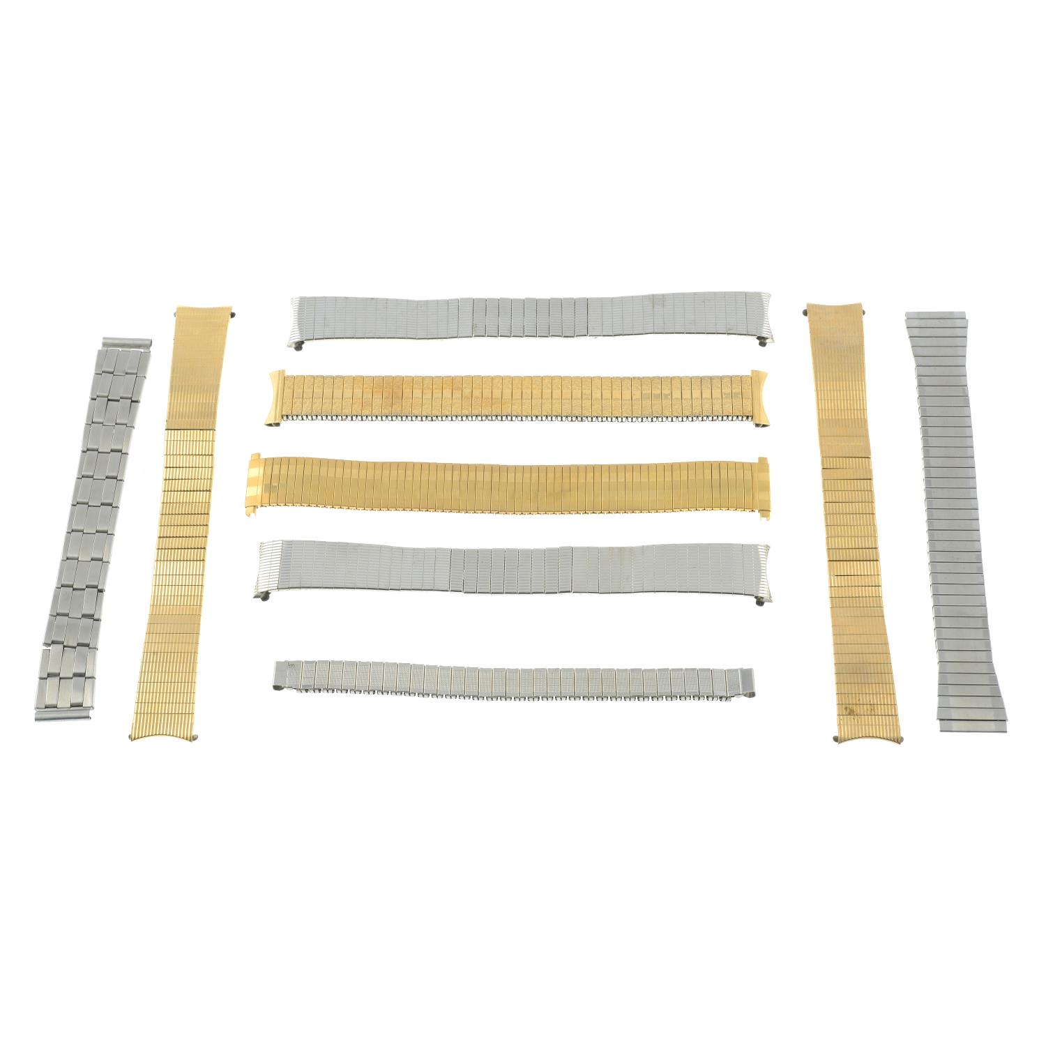 A group of assorted watch bracelets, watch straps and watch movements.