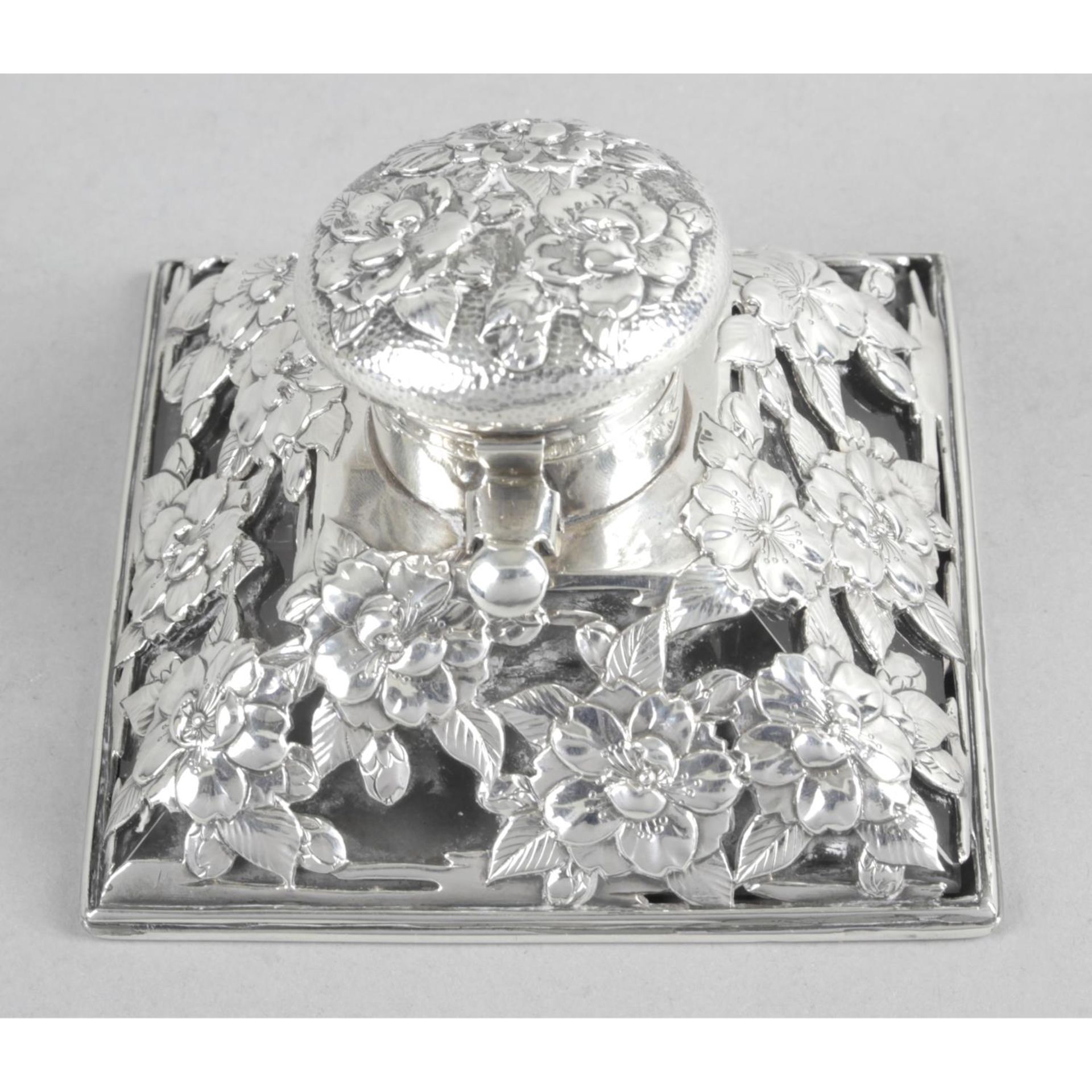 A Japanese Meiji period silver mounted and glass inkwell,