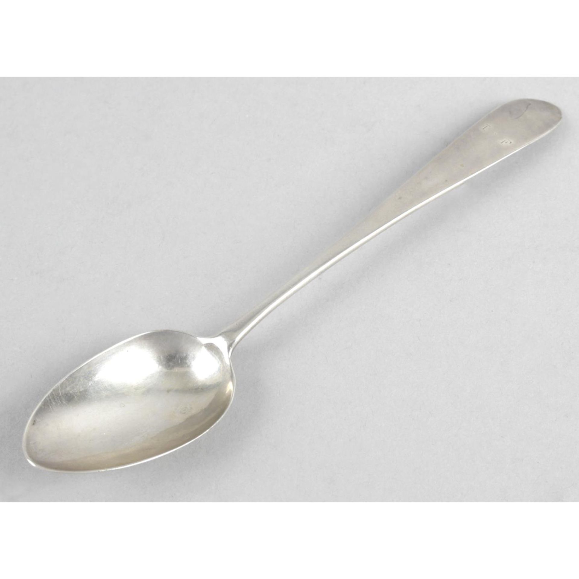 An Irish provincial silver Celtic point spoon, with engraved initials I.F to the terminal.