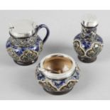 A silver mounted Doulton Lambeth stoneware condiment set,