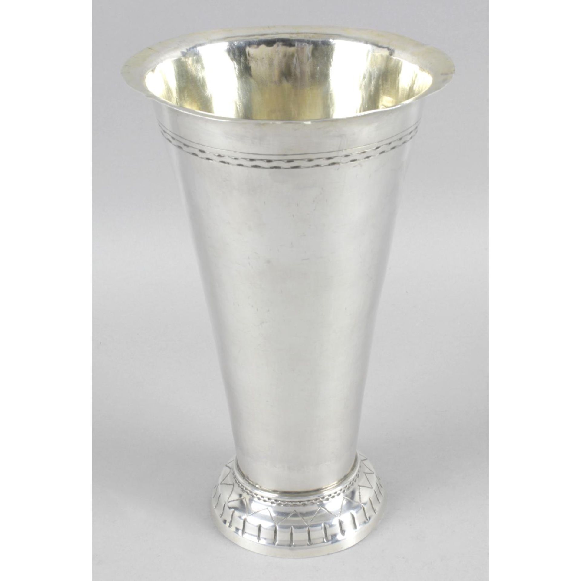 An early George V silver gambling cup of tapered cylindrical form with flared rim and silver gilt