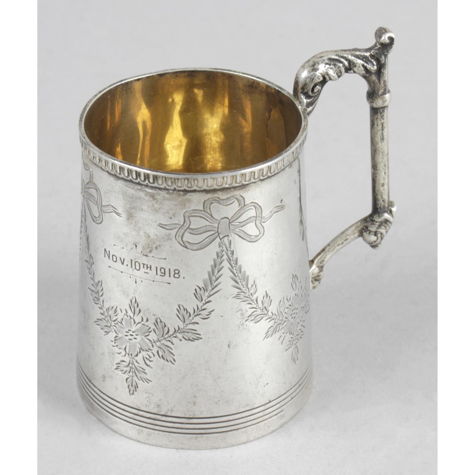 An early 20th century silver christening mug,