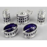 A matched early 20th century silver condiment set,