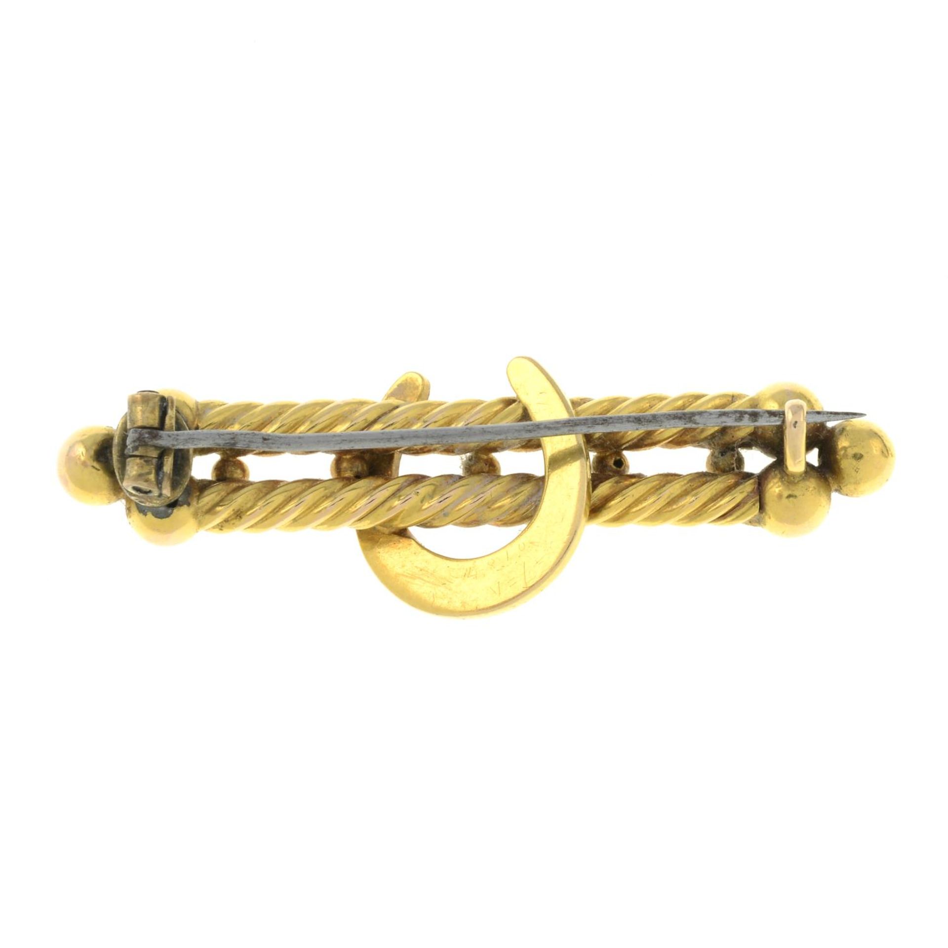 An early 20th century gold split pearl horseshoe double bar brooch.Length 4.9cms. - Image 2 of 2