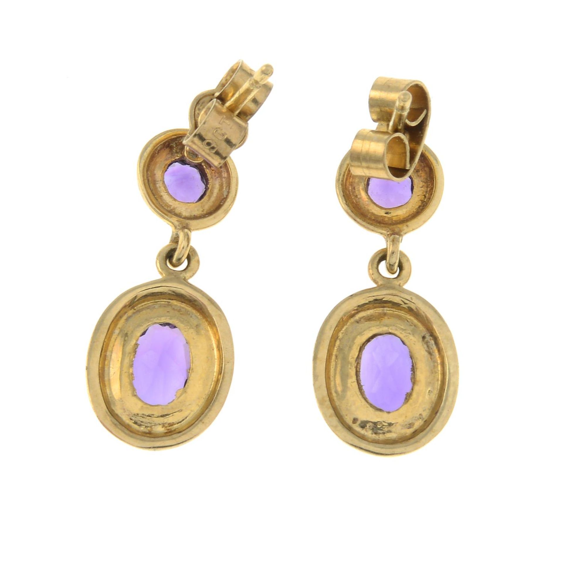 A pair of 9ct gold amethyst earrings.Import marks for Birmingham.Length 1.9cms. - Image 2 of 2