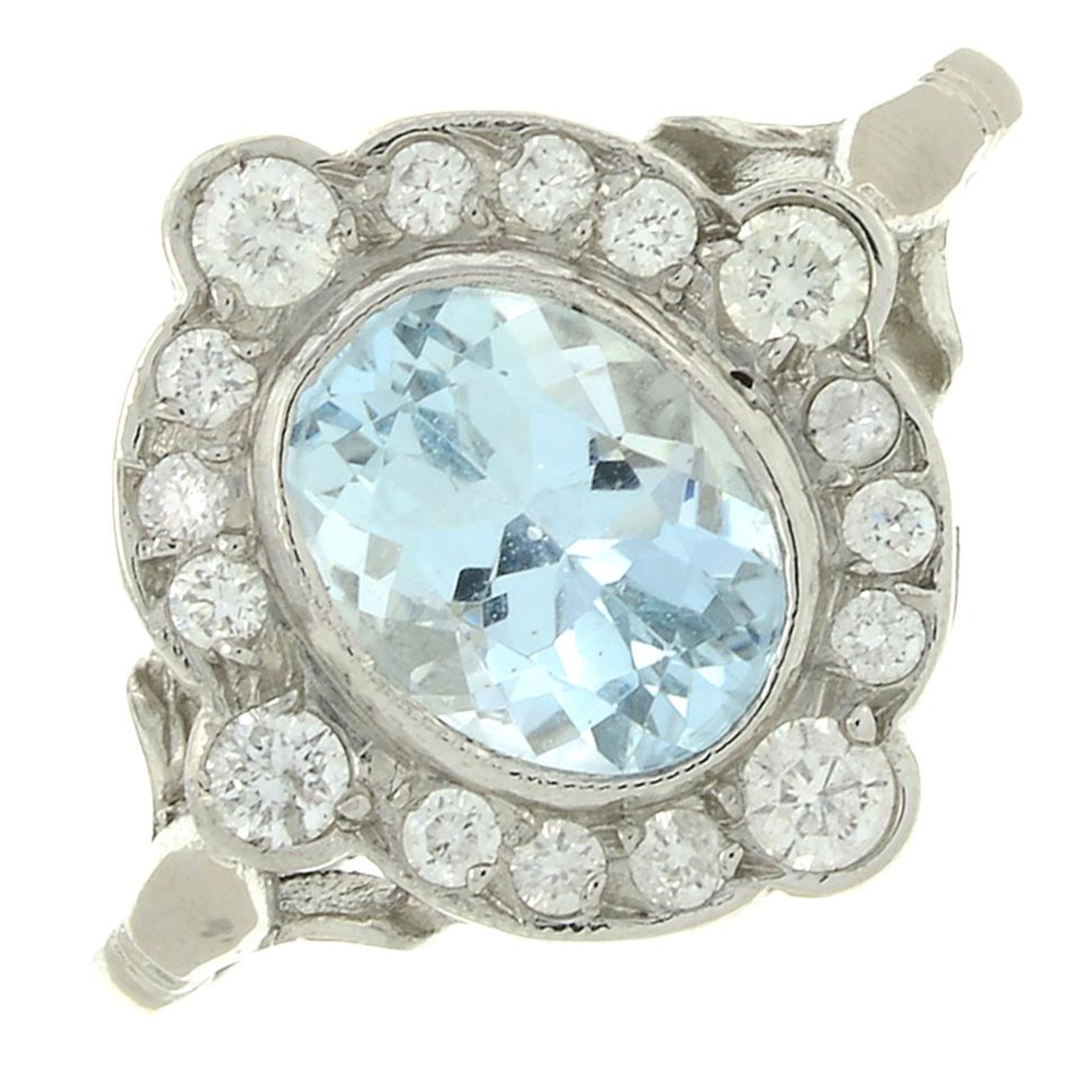An aquamarine and diamond cluster ring.Aquamarine calculated weight 1.15ct,
