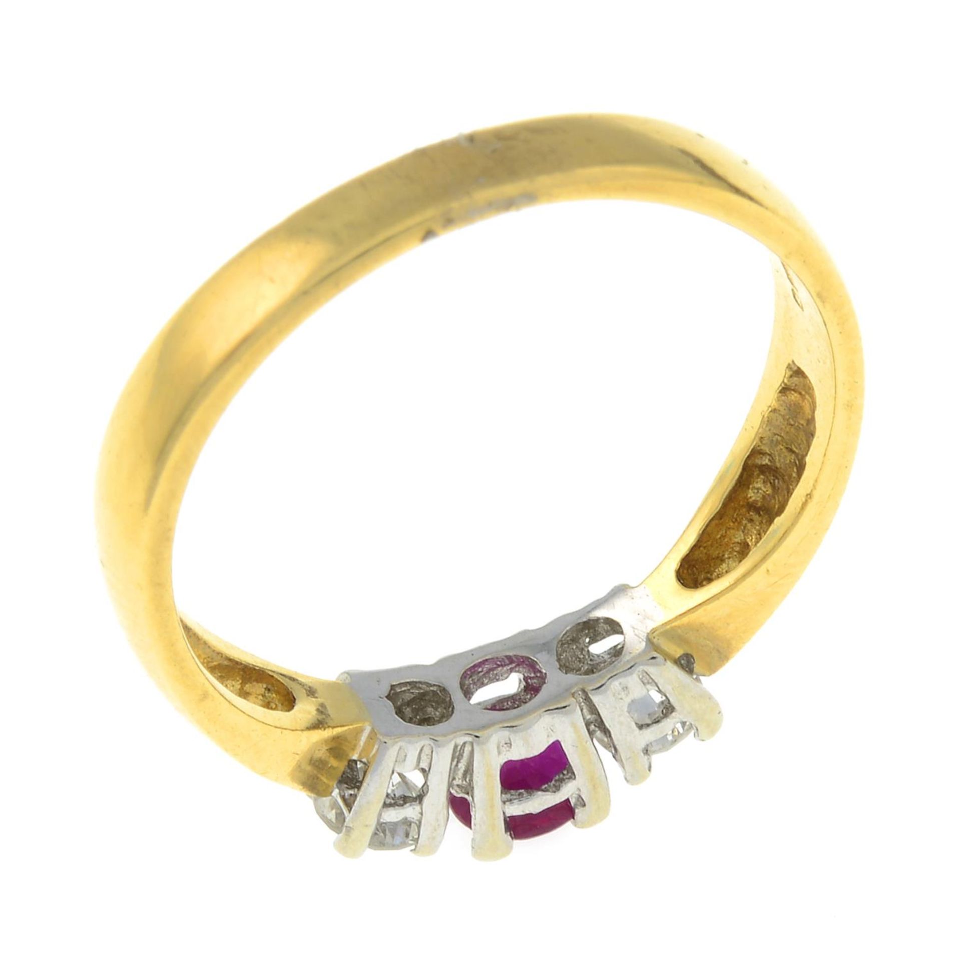 An 18ct gold ruby and diamond three-stone ring.Total diamond weight 0.25ct, stamped to band. - Image 3 of 3