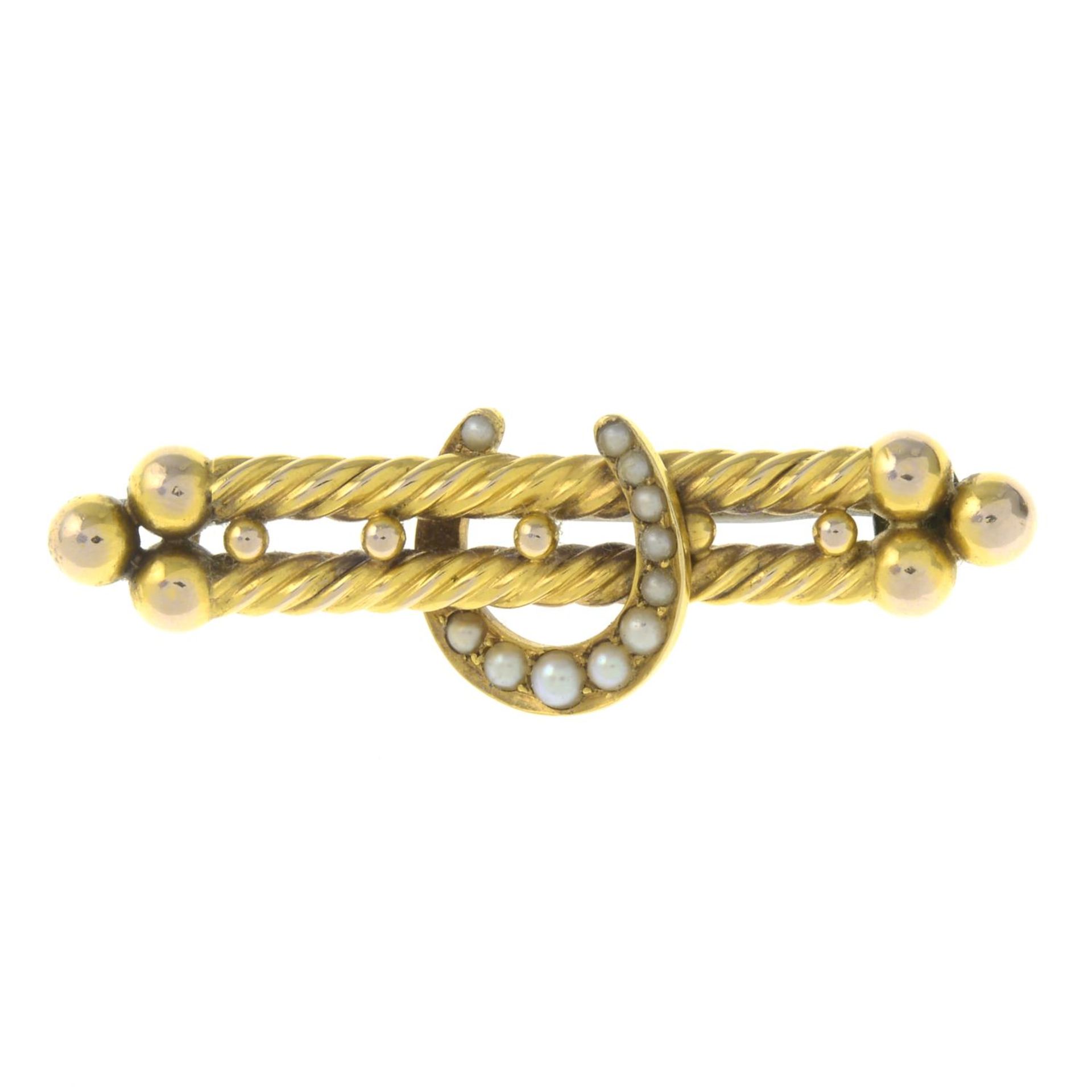 An early 20th century gold split pearl horseshoe double bar brooch.Length 4.9cms.