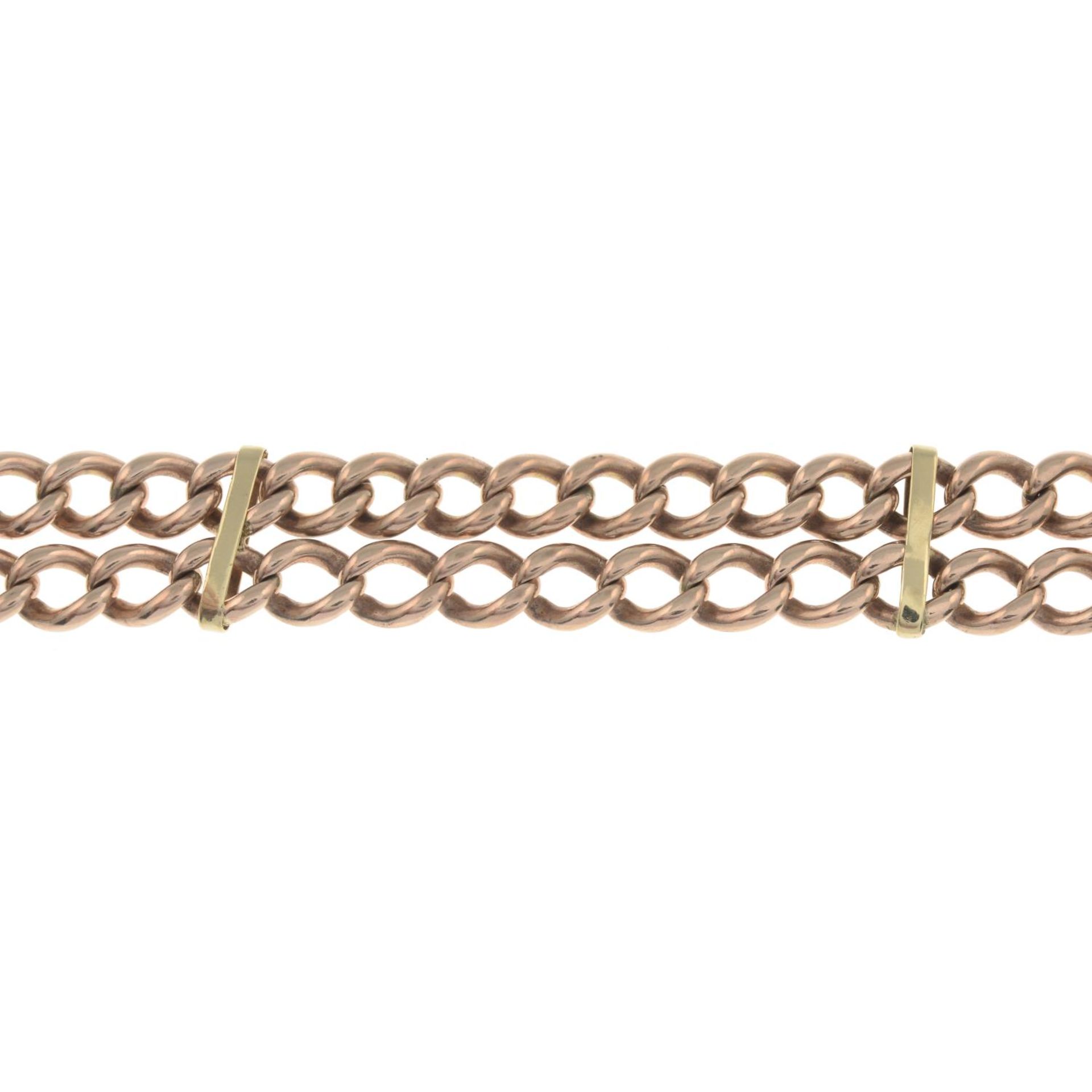 An early 20th century double-row curb-link chain bracelet.Clasp deficient.Stamped 375,