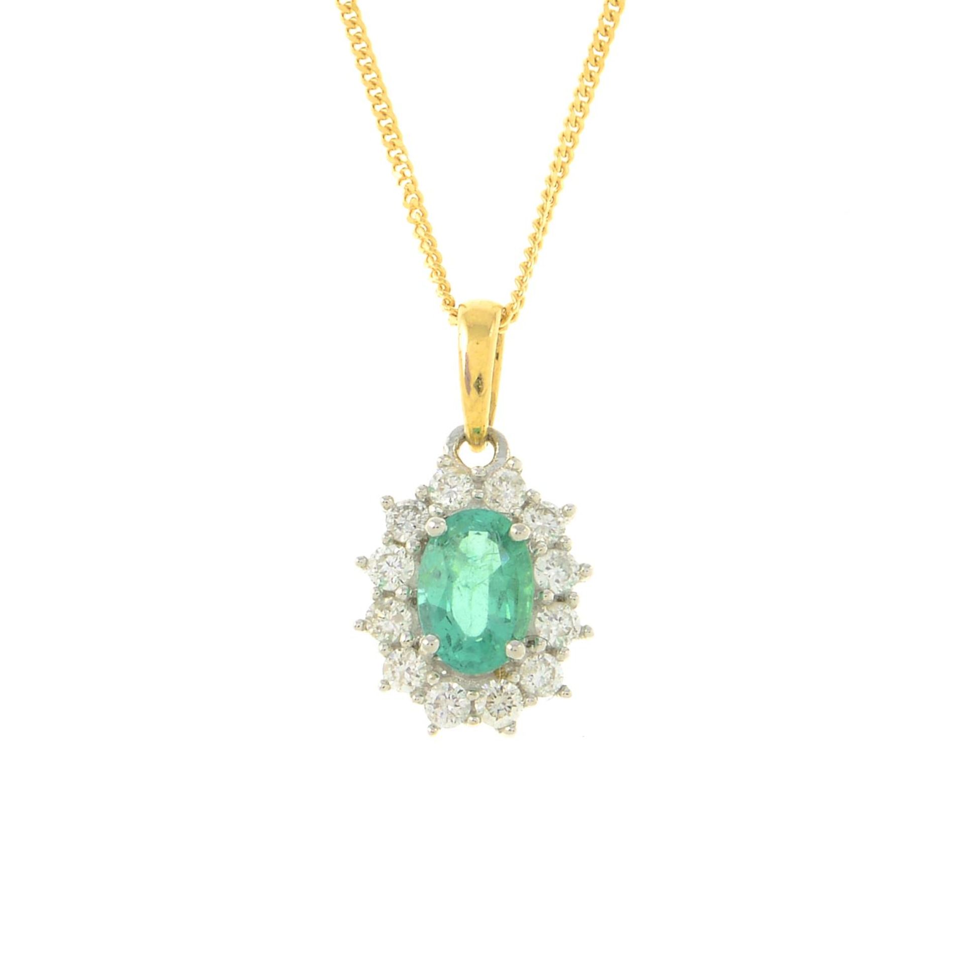 An 18ct gold emerald and diamond cluster pendant,