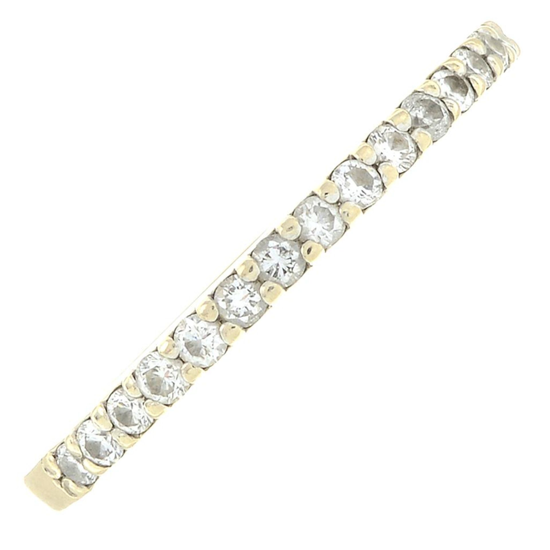 A brilliant-cut diamond half eternity ring.Estimated total diamond weight 0.30ct.Ring size L.
