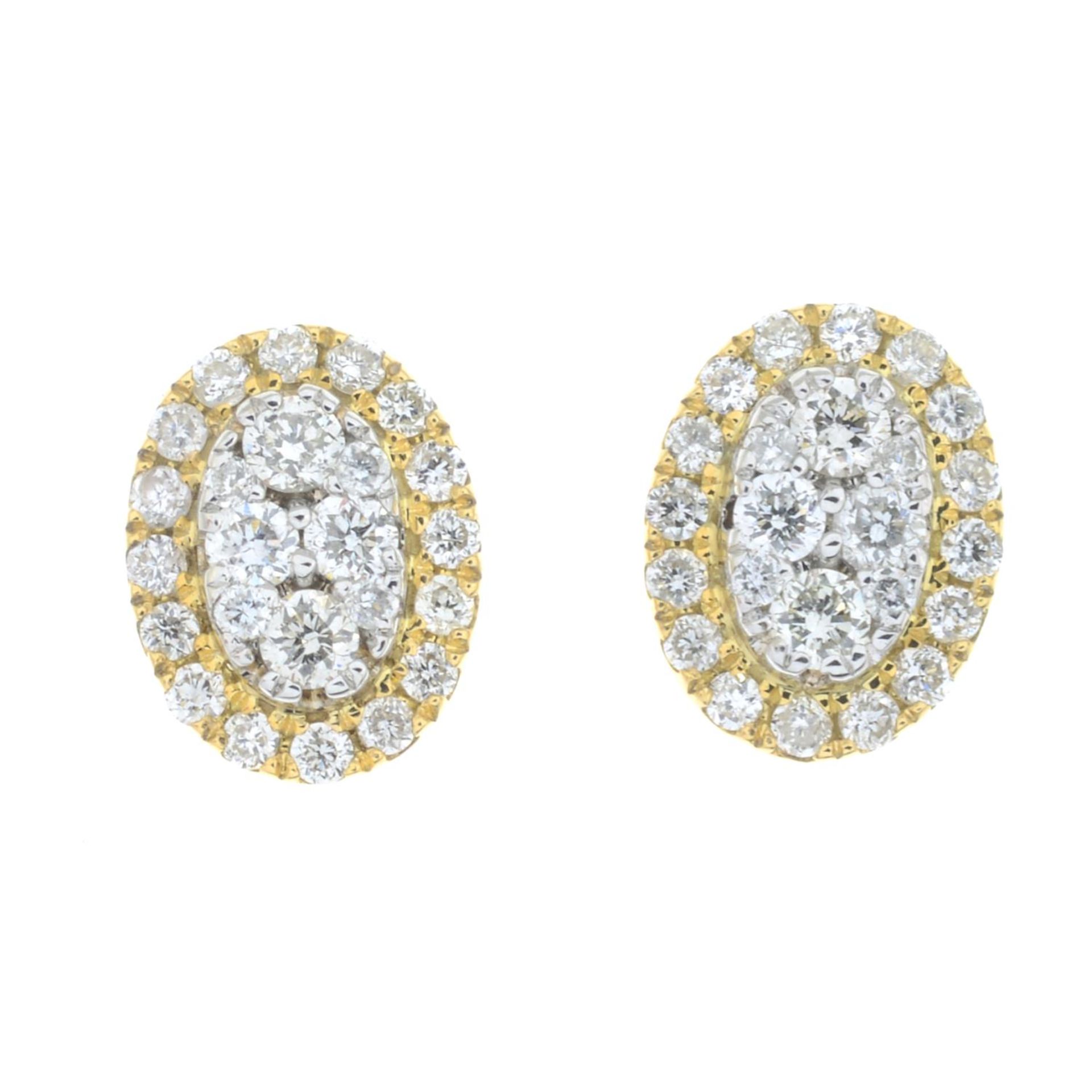 A pair of 18ct gold diamond cluster earrings.Total diamond weight 0.29ct.