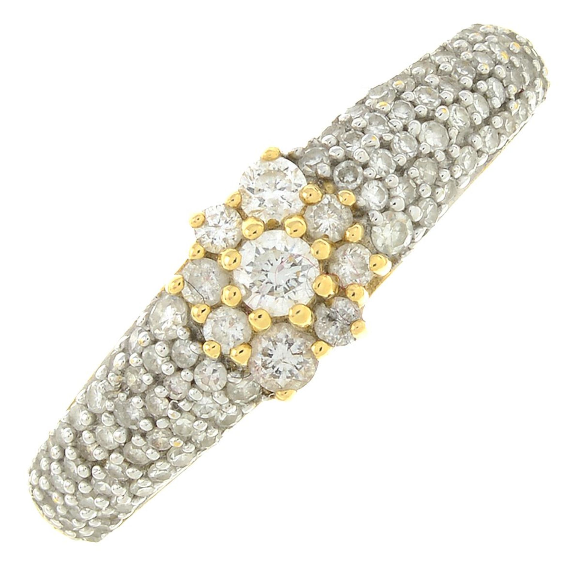 An 18ct gold brilliant-cut diamond dress ring.Estimated total diamond weight 0.40ct.Hallmarks for