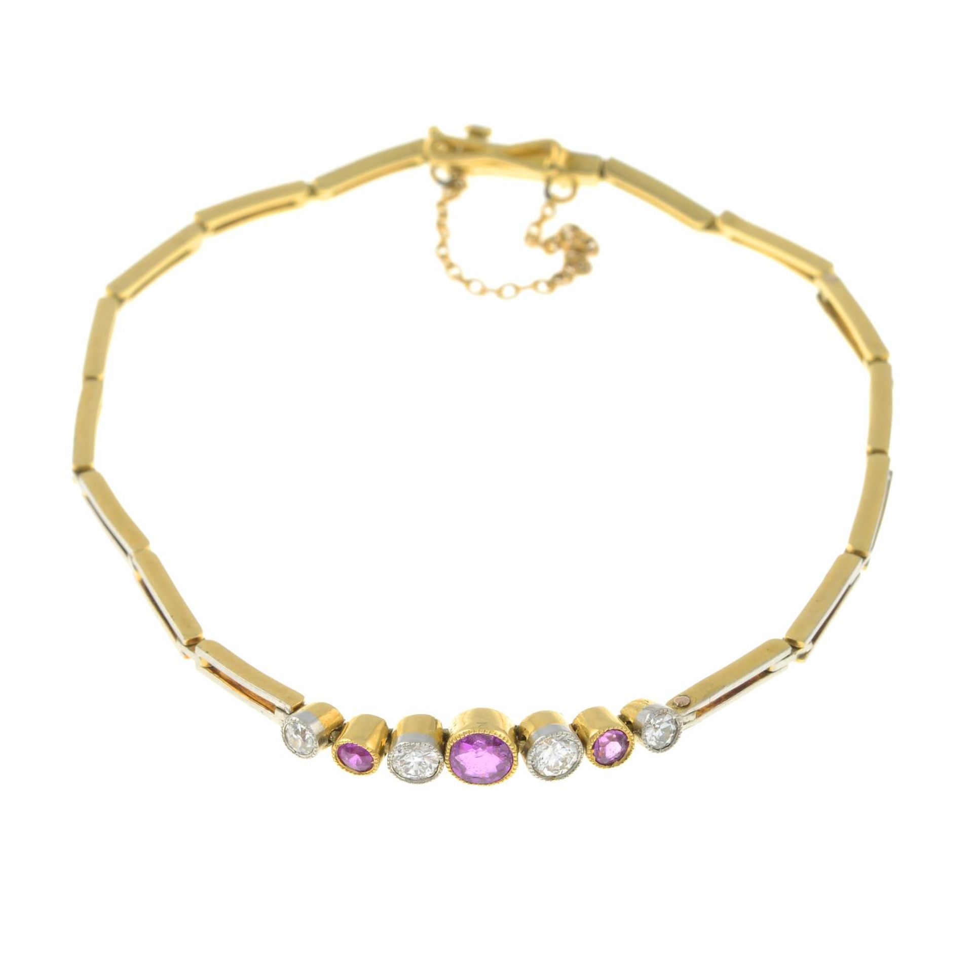 An 18ct gold pink sapphire and diamond bracelet.Estimated total diamond weight 0.20ct,