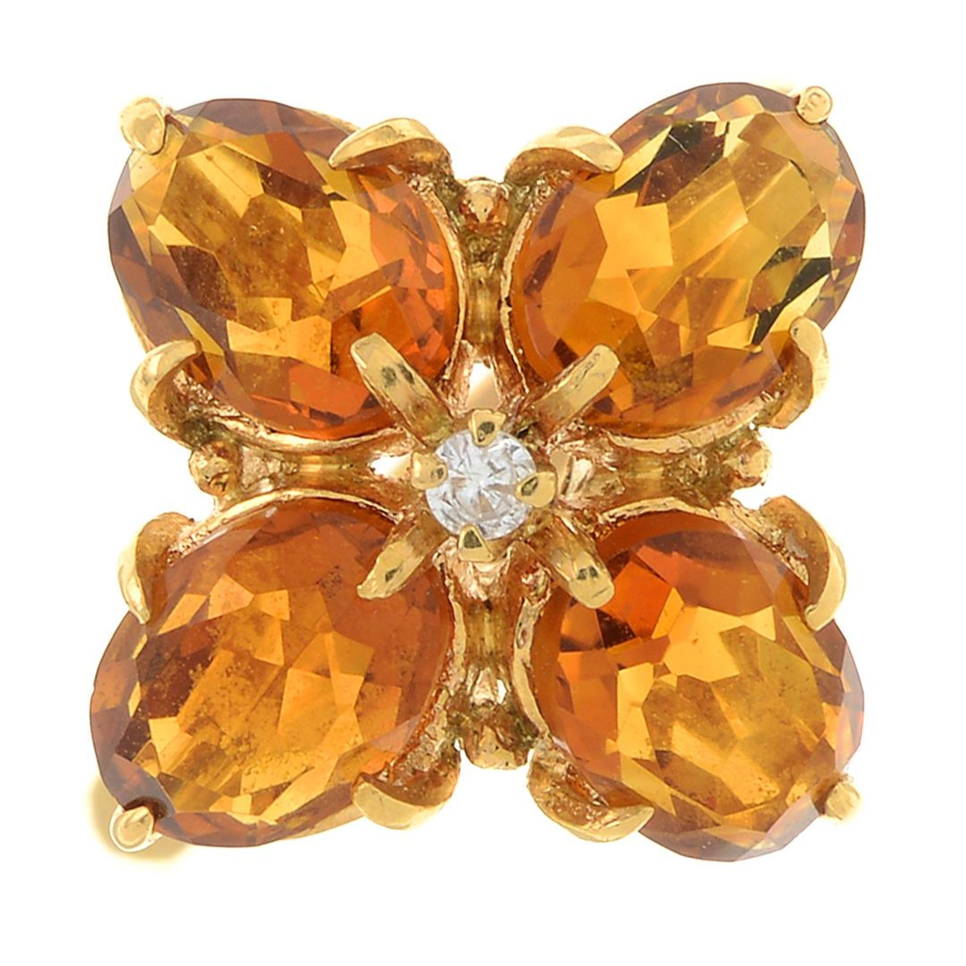 A citrine and diamond floral cluster ring.Stamped K18.