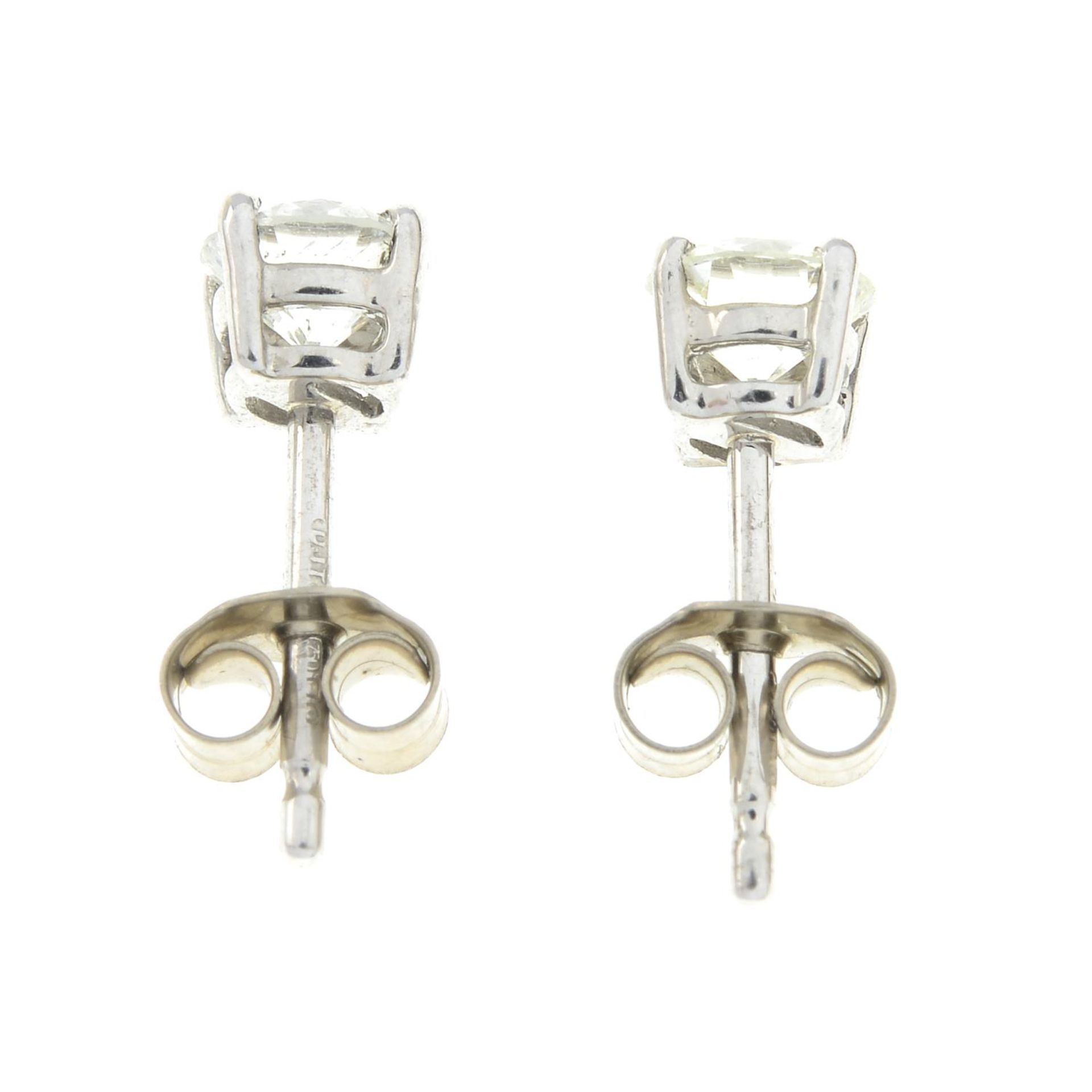 A pair of 18ct gold diamond stud earrings.Estimated total diamond weight 0.80ct, - Image 2 of 2