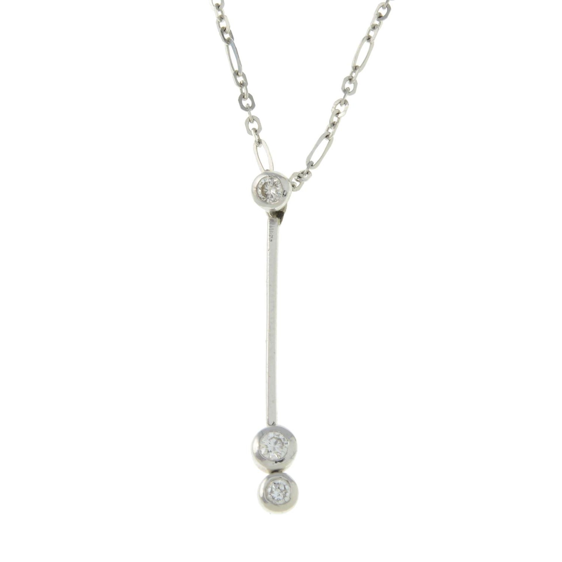 A brilliant-cut diamond pendant, on an integral chain.