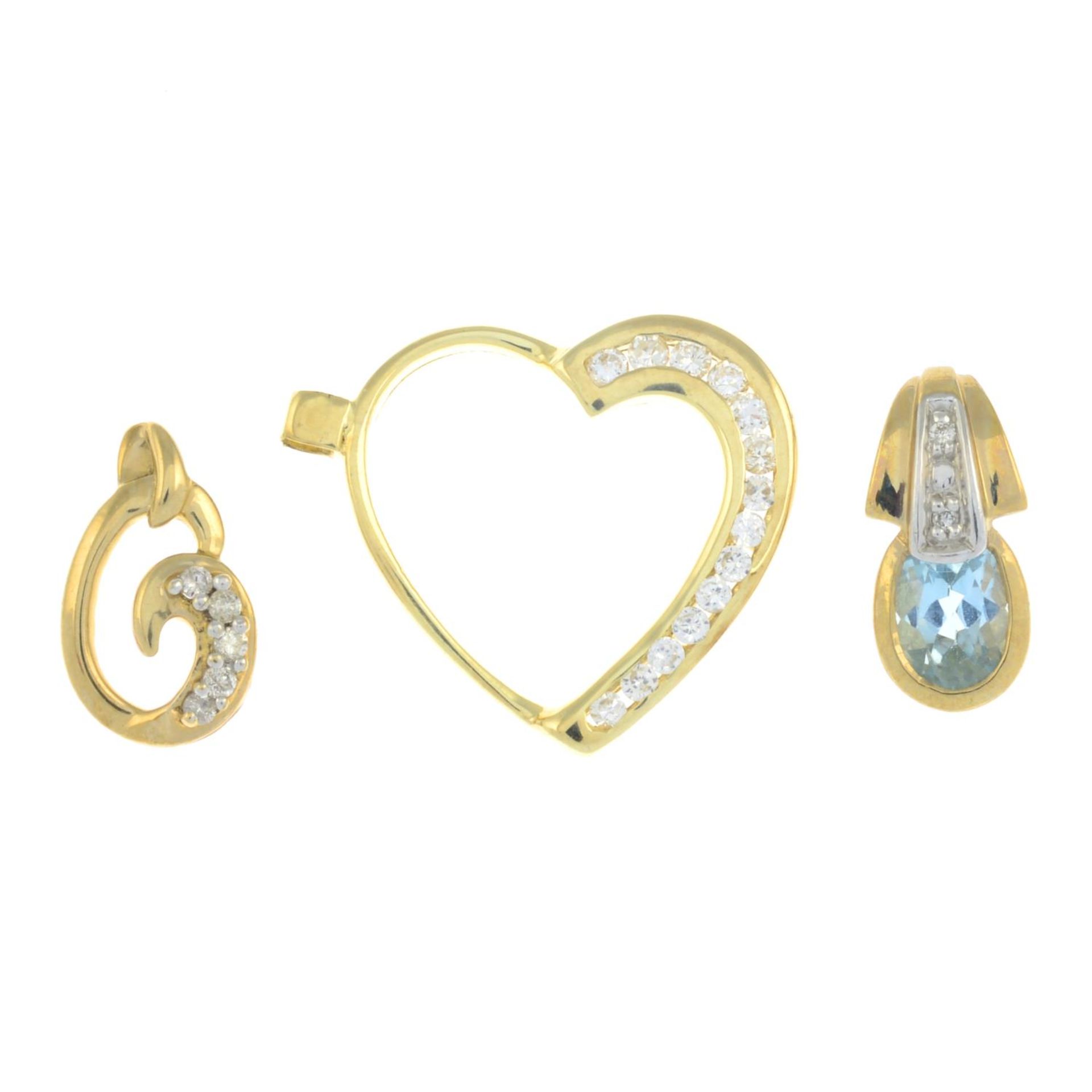 Two 9ct gold diamond and blue topaz pendants,