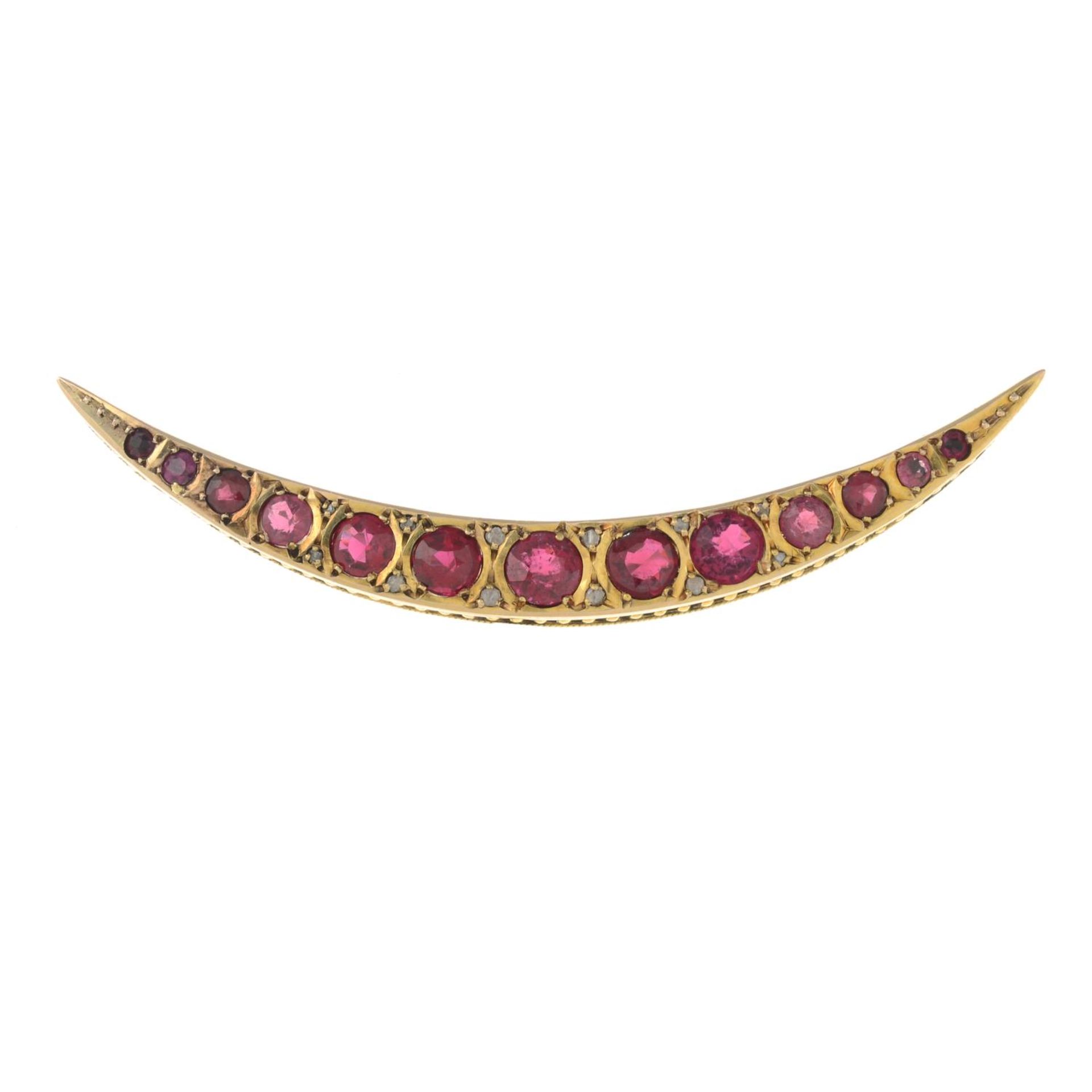 An Edwardian 9ct gold garnet-topped-doublet and diamond crescent brooch.Hallmarks for Chester,