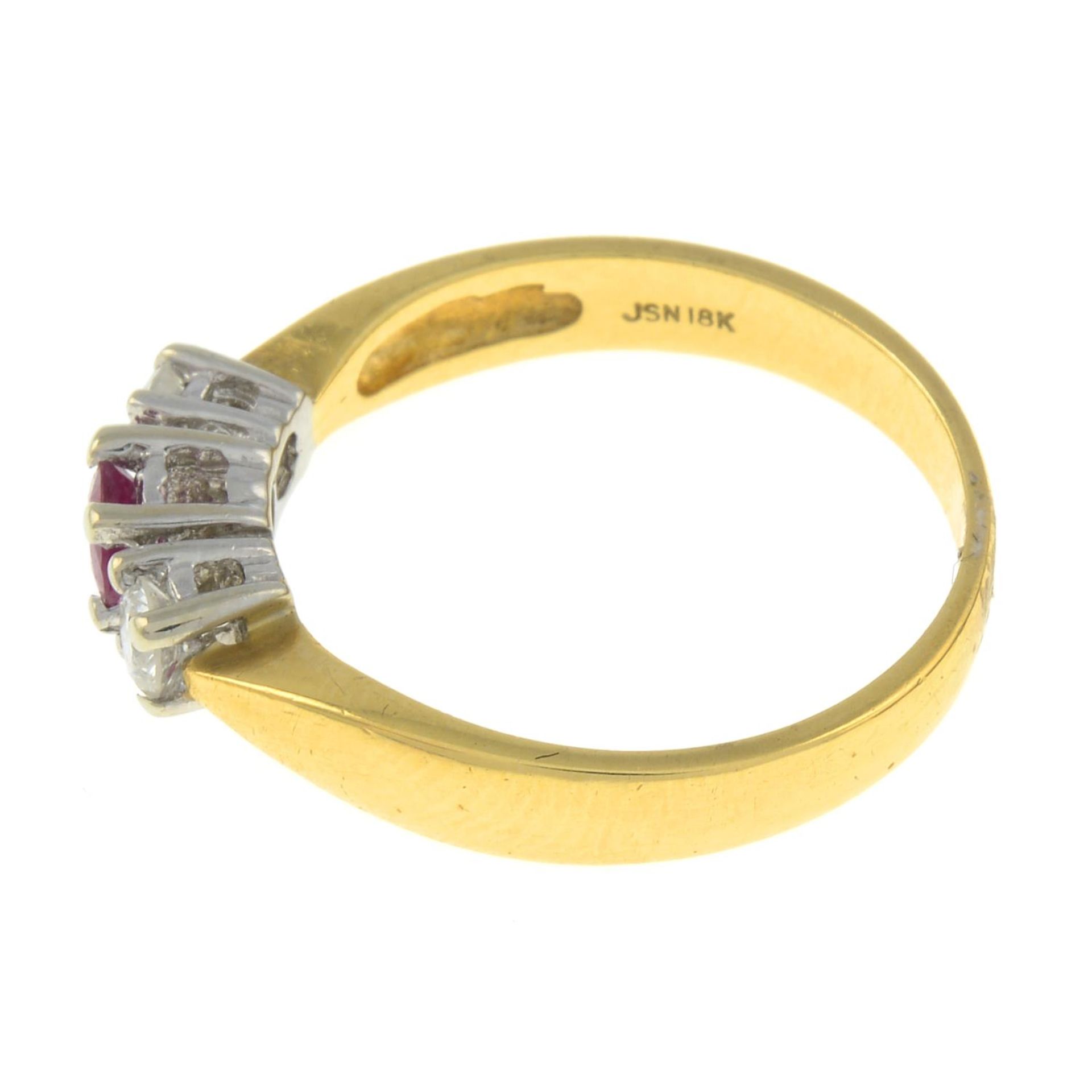 An 18ct gold ruby and diamond three-stone ring.Total diamond weight 0.25ct, stamped to band. - Image 2 of 3