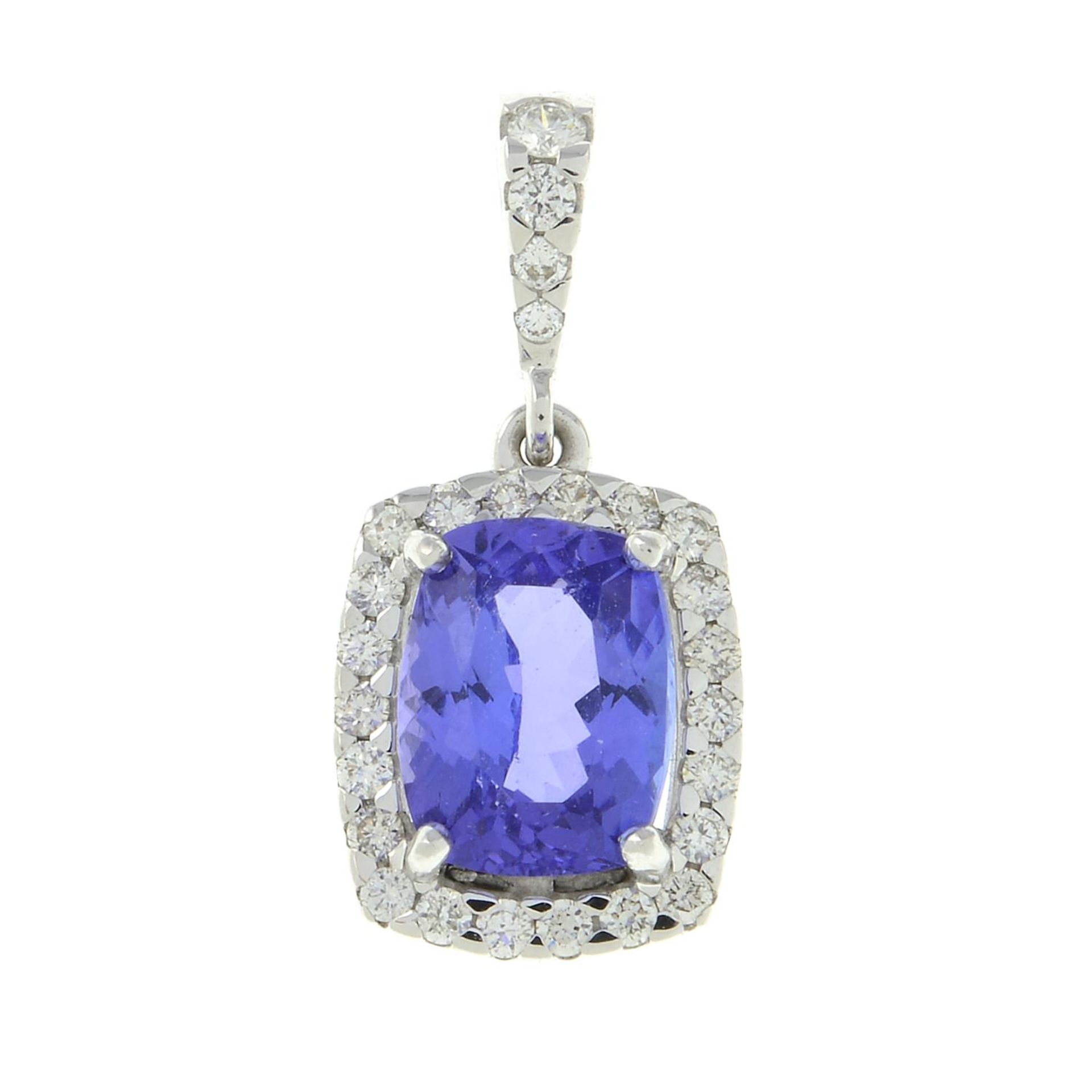 A tanzanite and brilliant-cut diamond cluster pendant.Tanzanite calculated weight 2.60cts,