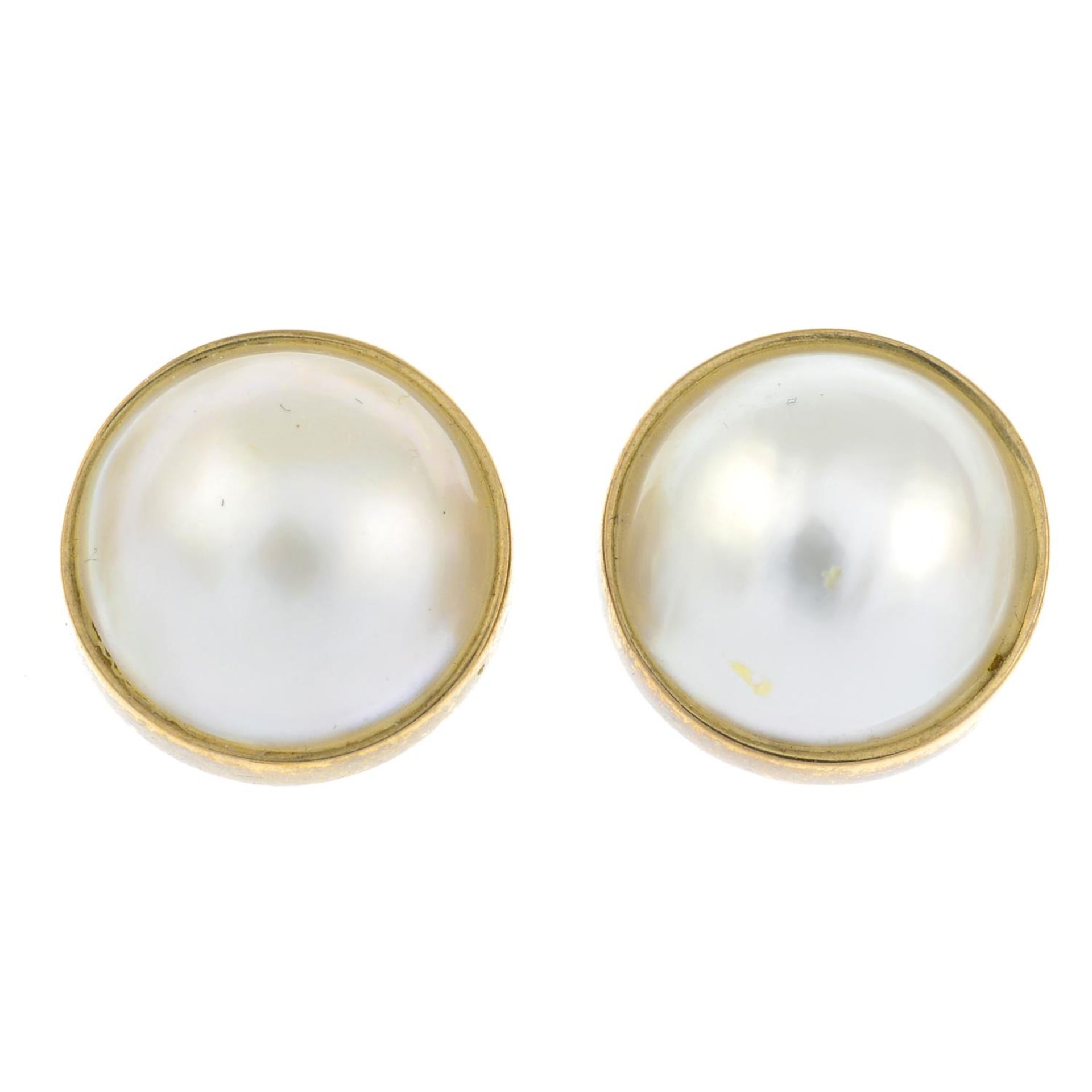 A pair of 9ct gold cultured mabe pearl stud earrings.Hallmarks for Sheffield.Length 1.3cms.