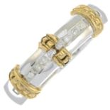 A 9ct gold bi-colour diamond band ring.Total diamond weight stamped to band 0.15cts.Hallmarks for