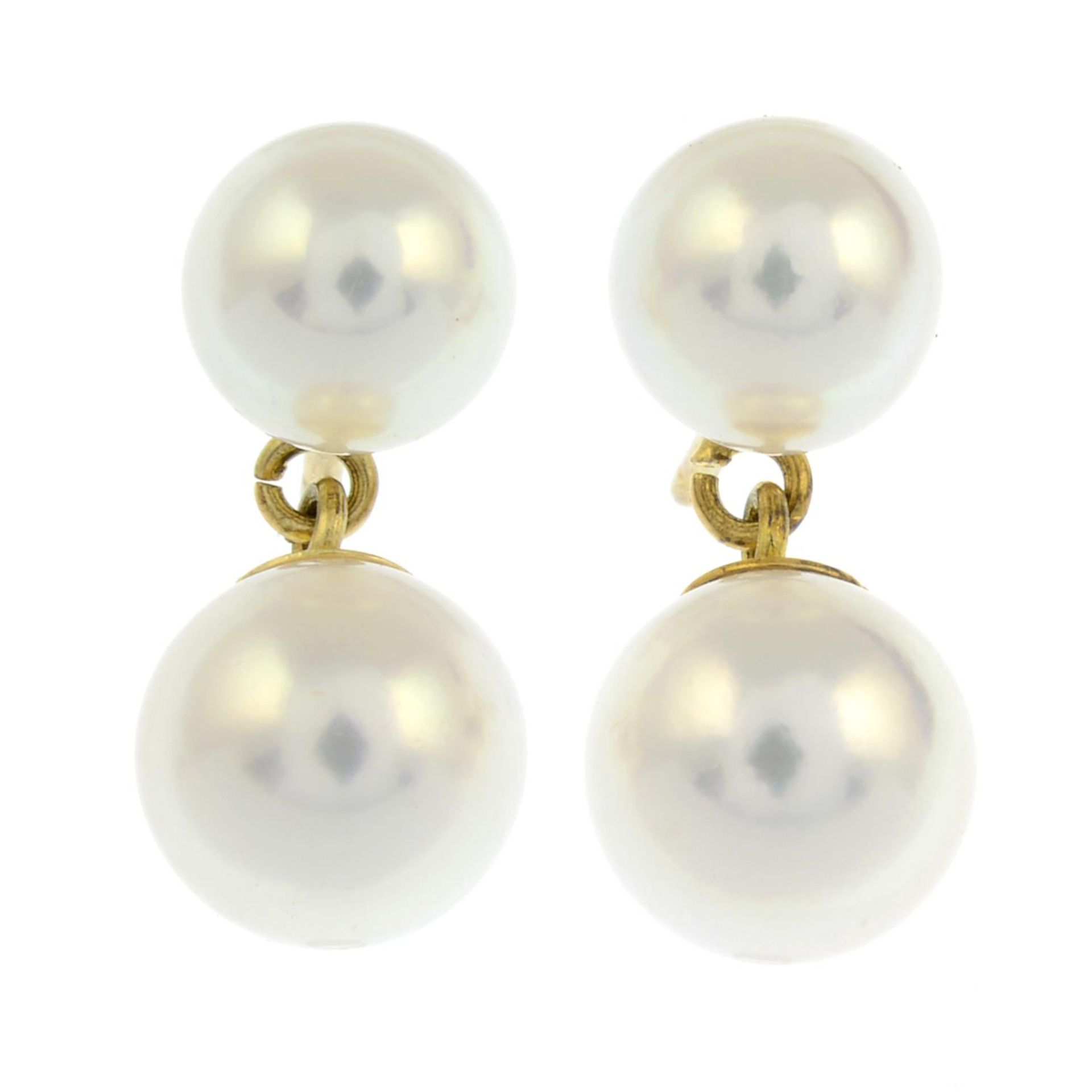 A pair of 18ct gold cultured pearl stud earrings with a suspended cultured pearl.Hallmarks for