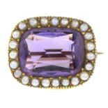 An amethyst and split pearl cluster brooch.Length 2cms.