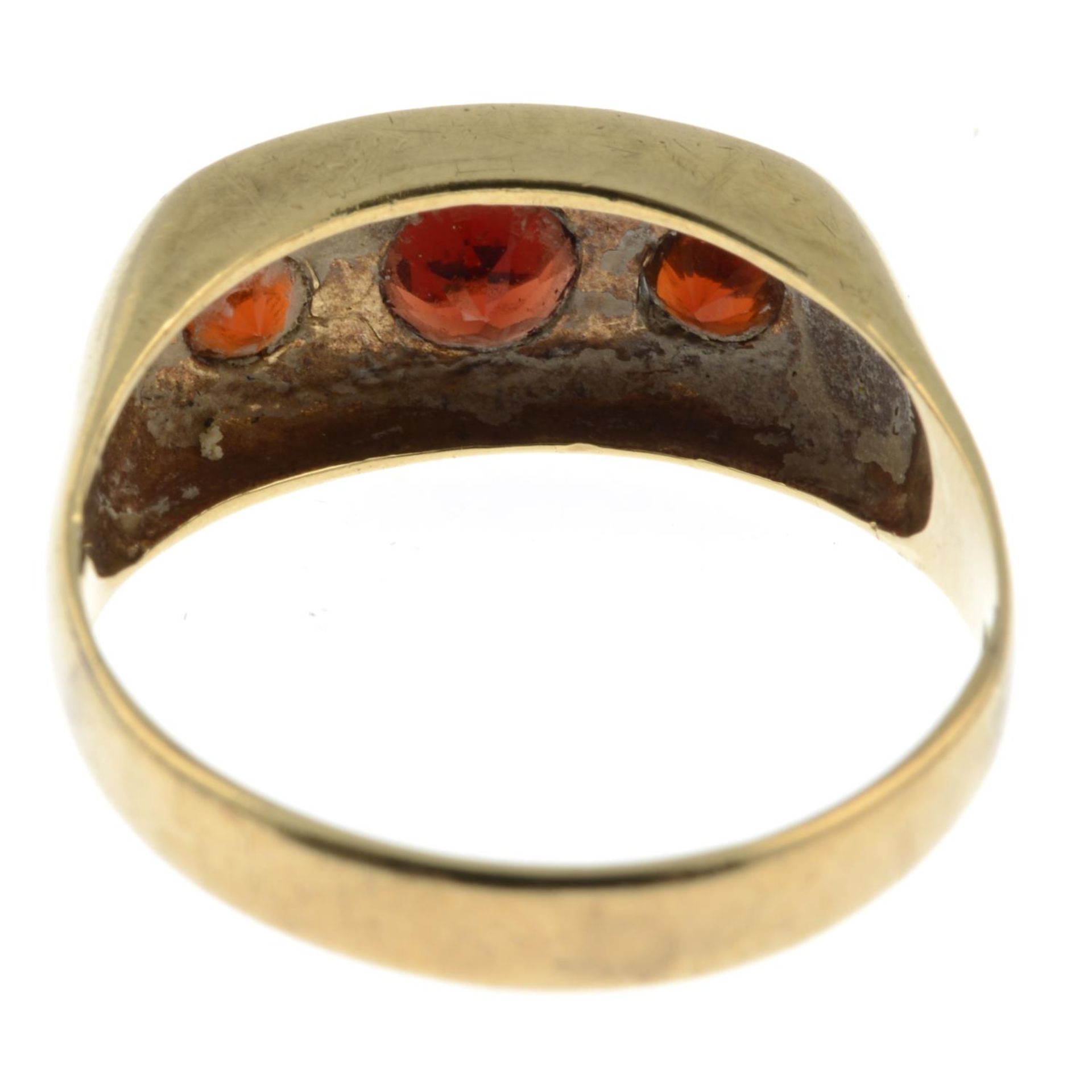 A garnet three-stone ring.Stamped 9c.Ring size Z. - Image 2 of 2