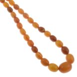 An amber graduated bead necklace.