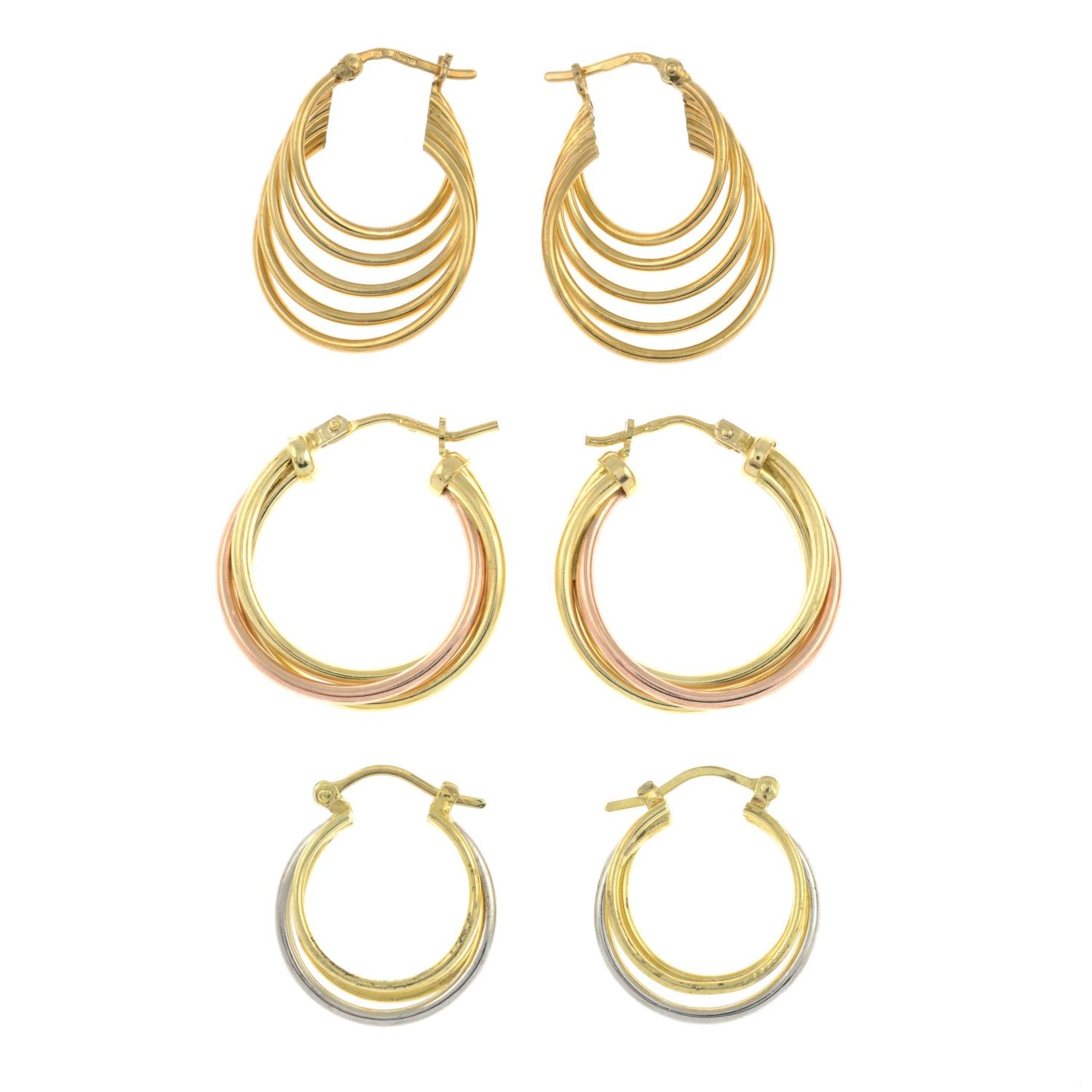 Two pairs of 9ct gold hoop earrings together with a further pair.Two with hallmarks for 9ct gold.
