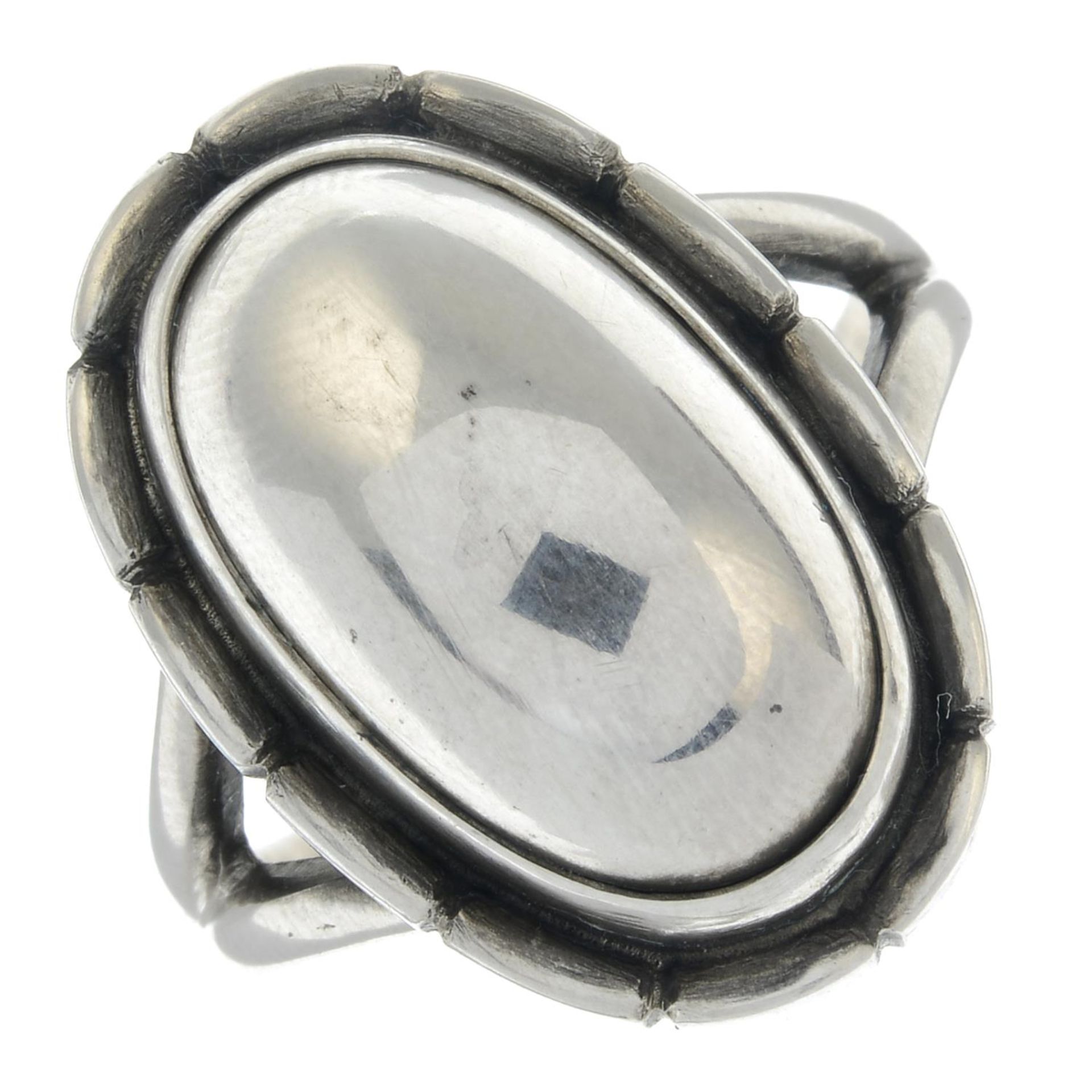 An oval ring with a beaded surround, by Georg Jensen.Signed Georg Jensen.