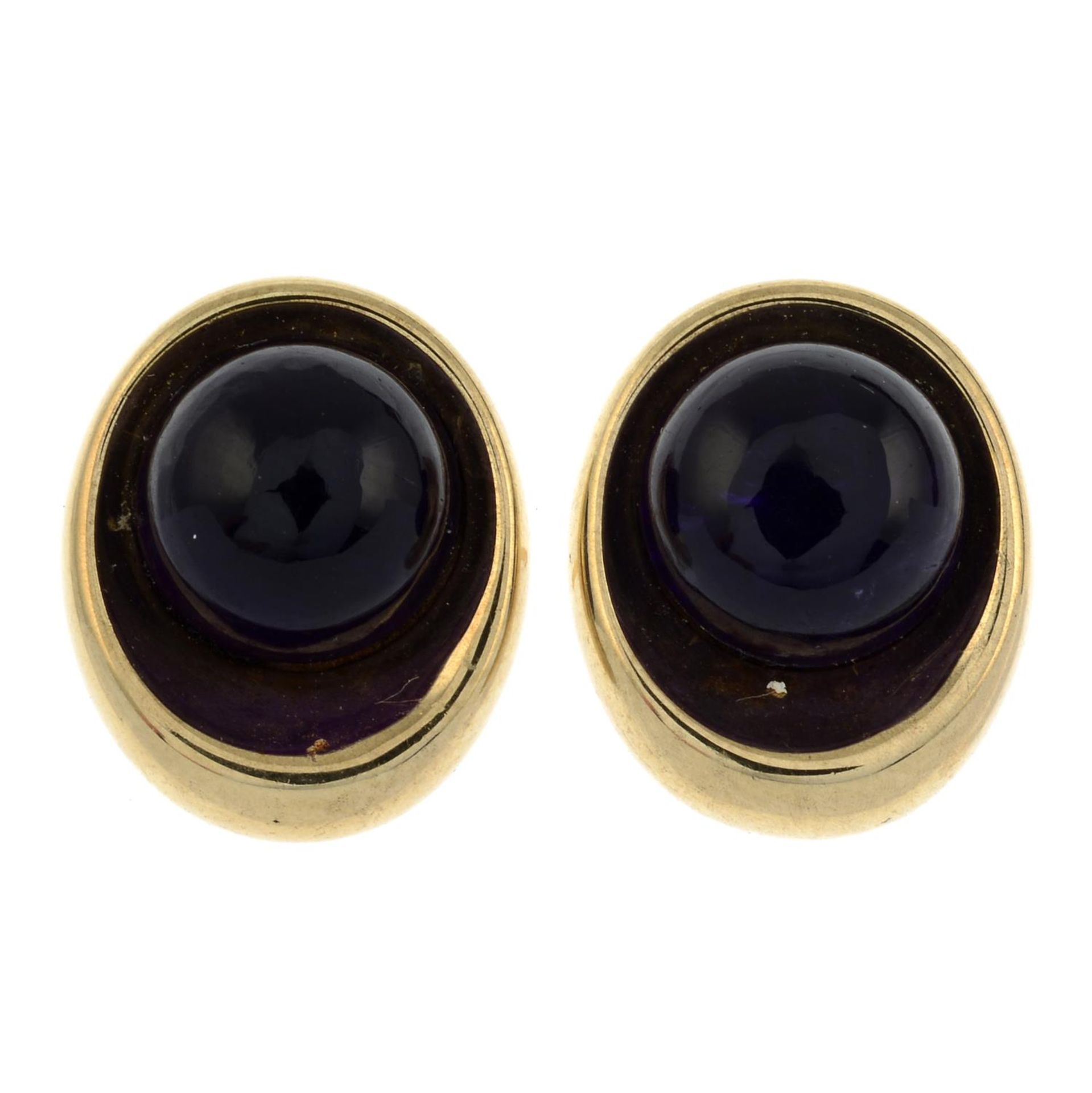 A pair of 9ct gold amethyst cabochon stud earrings.Hallmarks for Sheffield.Length 1.4cms.