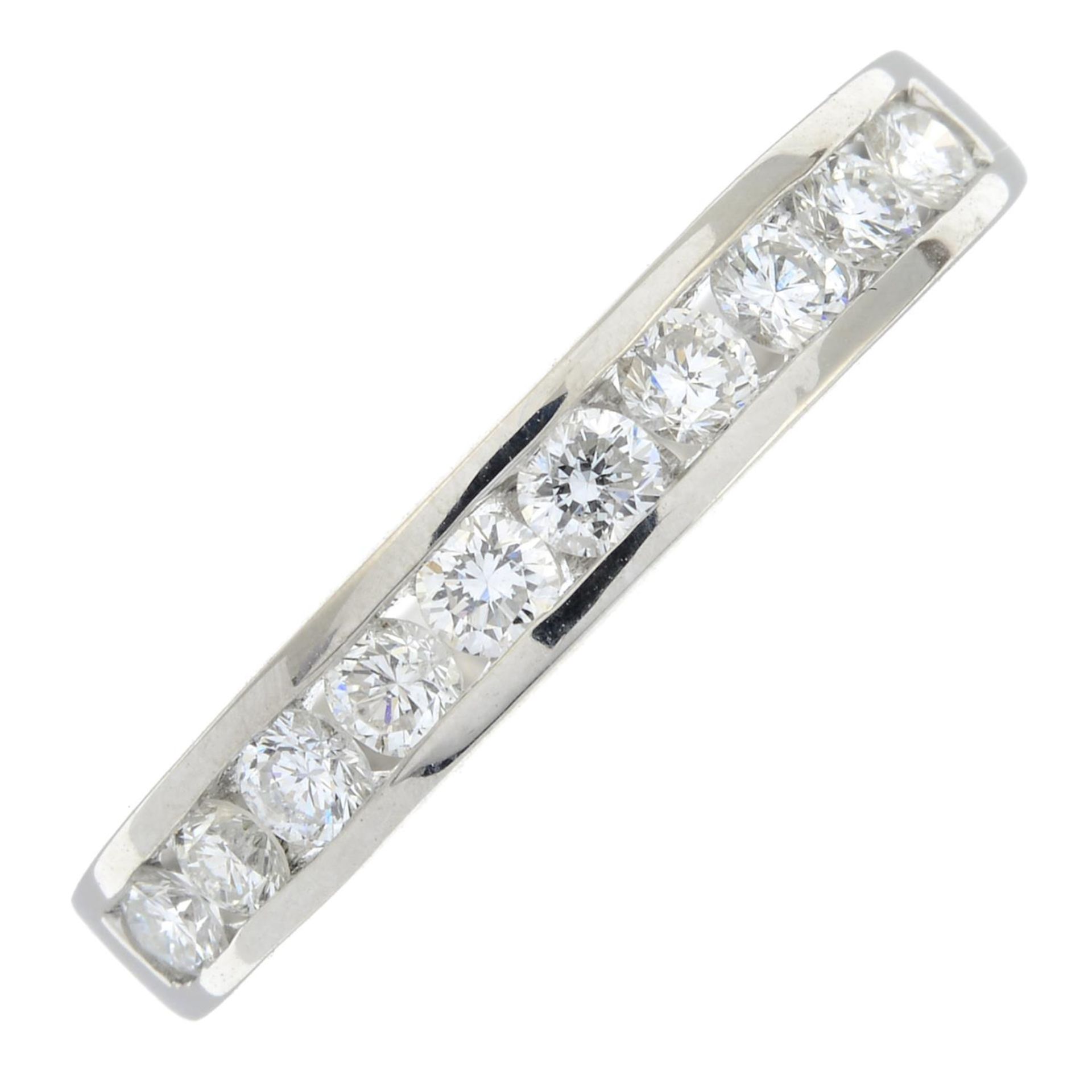 An 18ct gold diamond half eternity ring.Estimated total diamond weight 0.5cts.Stamped 750.Ring size