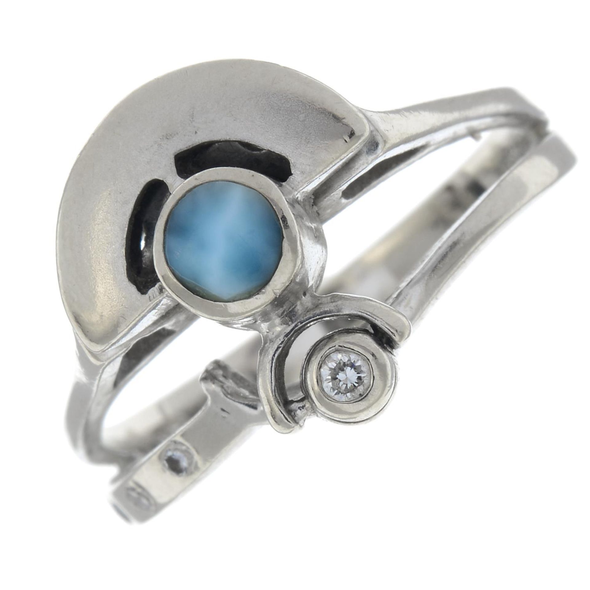 A diamond and larimar ring of contemporary design.Stamped 14k.Ring size P1/2.