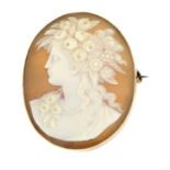 A 9ct gold shell cameo brooch of a lady wearing a floral wreath.Stamped 9ct.Length 4.1cms.