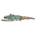 A marcasite and ruby plique-a-jour brooch of a grasshopper.Stamped 925.Length of brooch 7.2cms.